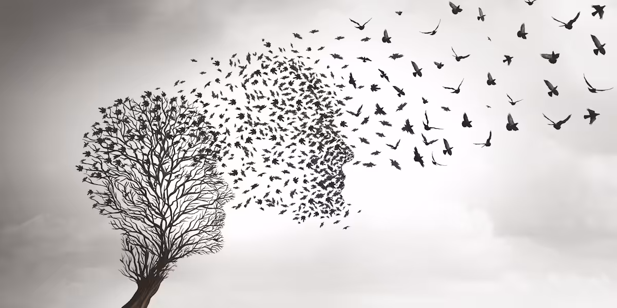 Ein Baum und Vögel bilden einen Kopf